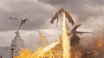 A Group Of Dragons Are Flying Over A Burning Castle . GIF