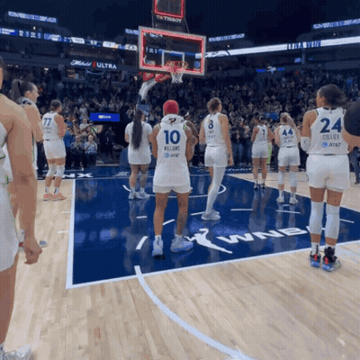 A Group Of Female Basketball Players Standing On A Court With One Wearing The Number 10 GIF