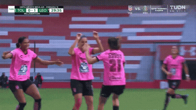 A Group Of Female Soccer Players Are Celebrating A Goal Against Leo GIF
