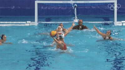 A Group Of Female Water Polo Players Are Playing A Game GIF