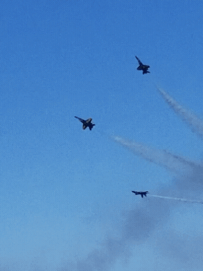 A Group Of Fighter Jets Are Flying In Formation In The Sky GIF