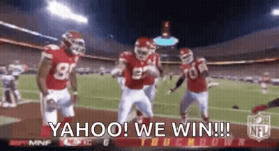 A Group Of Football Players Are Dancing On A Field With The Words Yahoo We Win Written On The Screen . GIF