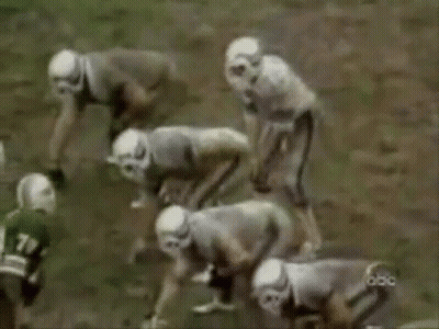 A Group Of Football Players Are On A Field And One Of Them Has The Number 78 On His Jersey GIF