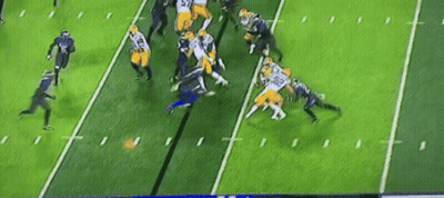 A Group Of Football Players Are On A Field . GIF