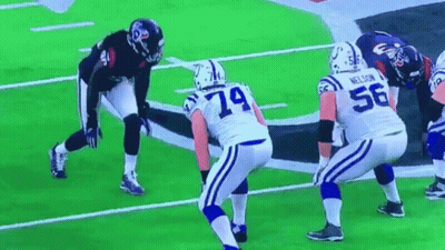 A Group Of Football Players Are On A Field With One Wearing The Number 56 GIF
