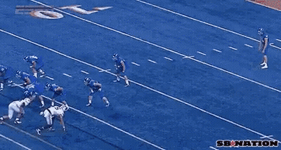 A Group Of Football Players Are Playing A Game And One Of Them Has The Number 56 On His Jersey GIF
