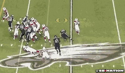 A Group Of Football Players Are Playing A Game On A Field And One Of The Players Has The Number 96 On His Jersey GIF