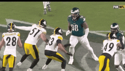 A Group Of Football Players Are Playing On A Field And One Of Them Has The Number 28 On His Jersey GIF
