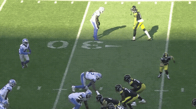 A Group Of Football Players Are Playing On A Field With The Number 3 On The Sidelines GIF