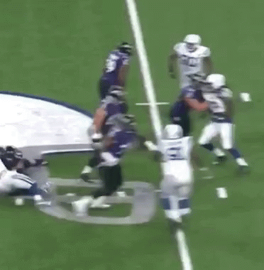 A Group Of Football Players Are Running On A Field With The Number 28 On Their Jersey GIF