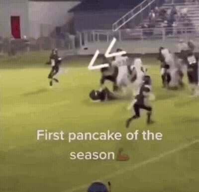 A Group Of Football Players Are Running On A Field With The Words `` First Pancake Of The Season '' Written On The Botto GIF