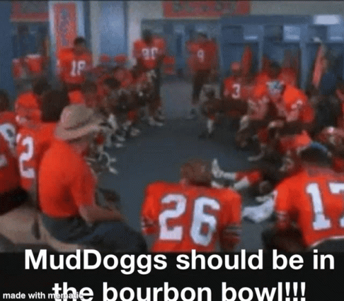 A Group Of Football Players Are Sitting In A Circle In A Locker Room And One Of Them Has The Number 26 On His Jersey GIF