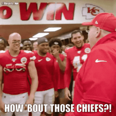 A Group Of Football Players Are Standing In Front Of A Sign That Says Win GIF