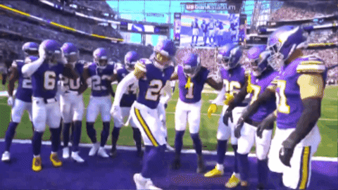 A Group Of Football Players Are Standing On A Field And One Has The Number 24 On His Jersey GIF