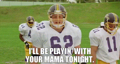 A Group Of Football Players Are Standing On A Field And One Of Them Is Wearing The Number 62 Jersey . GIF