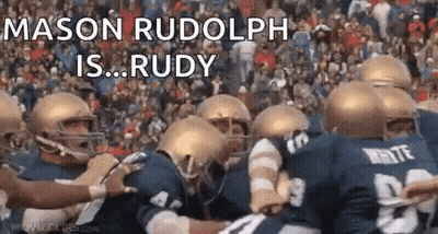 A Group Of Football Players Huddled Together With The Words Mason Rudolph Is Rudy Written Above Them GIF
