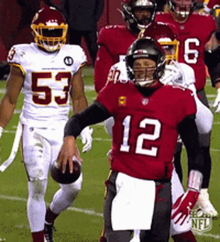 A Group Of Football Players Including Number 12 GIF