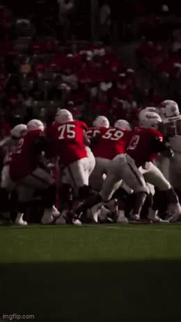 A Group Of Football Players Including Number 15 And Number 59 GIF