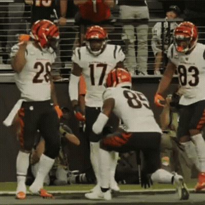 A Group Of Football Players Including Number 17 And 83 GIF