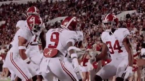 A Group Of Football Players Including Number 9 And 34 GIF