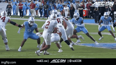 A Group Of Football Players On A Field With Accon Written On The Bottom GIF