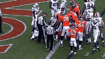 A Group Of Football Players On A Field With One Wearing The Number 83 GIF