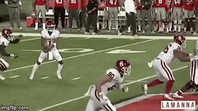 A Group Of Football Players On A Field With The Number 80 On The Back Of Their Jersey GIF