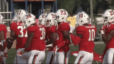 A Group Of Football Players One Of Whom Has The Number 10 GIF