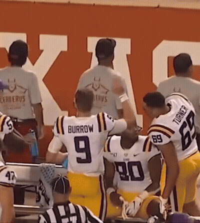 A Group Of Football Players One Of Whom Is Wearing A Number 9 Jersey GIF