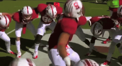 A Group Of Football Players With One Wearing The Number 86 On Their Jersey GIF