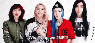A Group Of Four Women Are Standing Next To Each Other And Smiling . GIF
