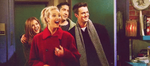 A Group Of Friends Are Standing Next To Each Other And Laughing . GIF