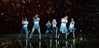 A Group Of Girls Are Dancing In Front Of A Black Background GIF