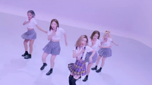 A Group Of Girls Are Dancing In Front Of A Sign That Says Choo GIF
