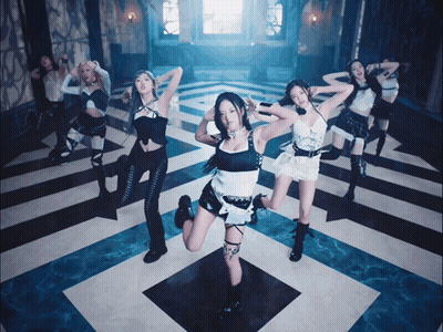 A Group Of Girls Are Dancing On A Checkered Floor GIF