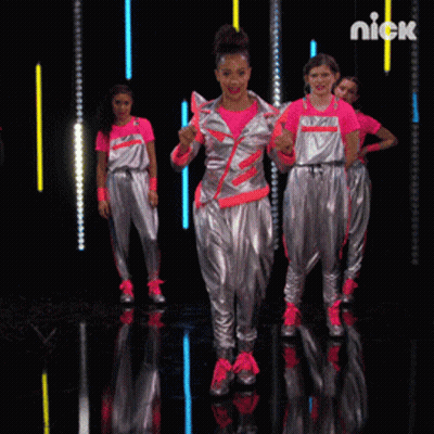 A Group Of Girls Are Dancing On A Stage And The Word Nick Is On The Bottom GIF