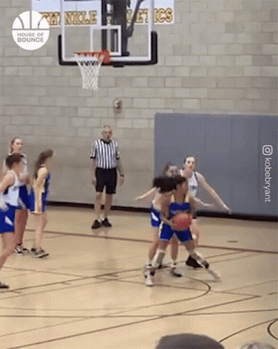 A Group Of Girls Are Playing Basketball On A Court With A Sign That Says ' Double Bounce ' GIF