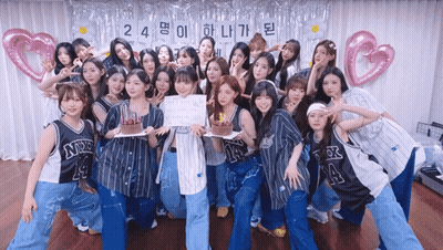 A Group Of Girls Are Posing For A Picture With A Sign That Says 24 GIF