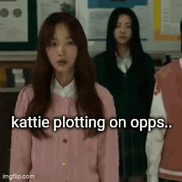 A Group Of Girls Are Standing In A Classroom And One Of Them Is Wearing A Pink Sweater . GIF