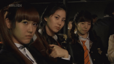 A Group Of Girls Are Standing In Front Of A Kbs2 Hd Screen GIF