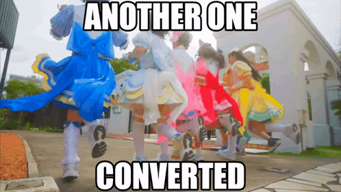 A Group Of Girls In Colorful Dresses Are Walking In Front Of A Building With The Caption Another One Converted GIF