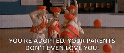 A Group Of Girls In Red Hats Are Dancing On A Stage While Holding Basketballs . GIF