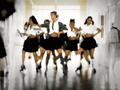 A Group Of Girls In School Uniforms Are Dancing In A Room GIF