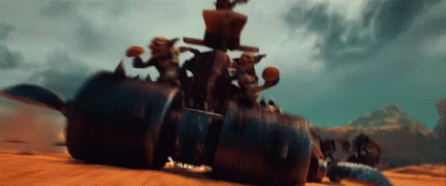 A Group Of Goblins Are Riding On The Back Of A Monster Vehicle GIF