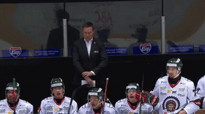 A Group Of Hockey Players Sitting In A Locker Room With A Sign That Says 4Sign On It GIF