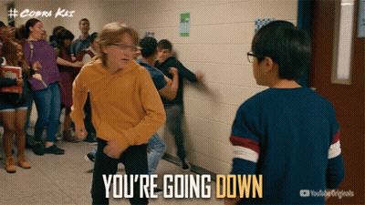 A Group Of Kids Are Dancing In A Hallway And The Caption Says " You 'Re Going Down " GIF