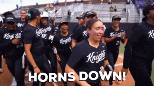 A Group Of Knights Softball Players Are Celebrating Their Victory GIF