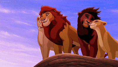 A Group Of Lions From The Lion King Standing On Top Of A Hill GIF