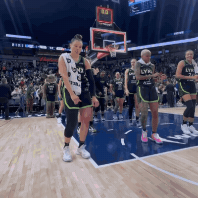 A Group Of Lynx Basketball Players Are Standing On The Court GIF