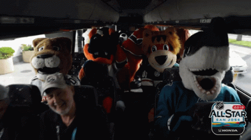 A Group Of Mascots Are Sitting In A Bus That Says Allstar San Jose GIF